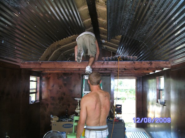 She added a tin ceiling inside after insulating and installed a beam 