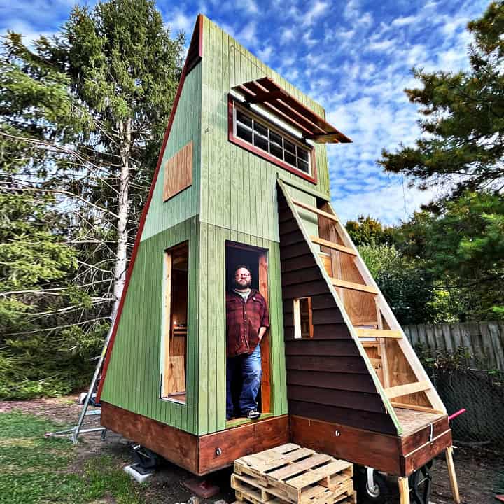 Compact tiny house with innovative design and eco-friendly features.