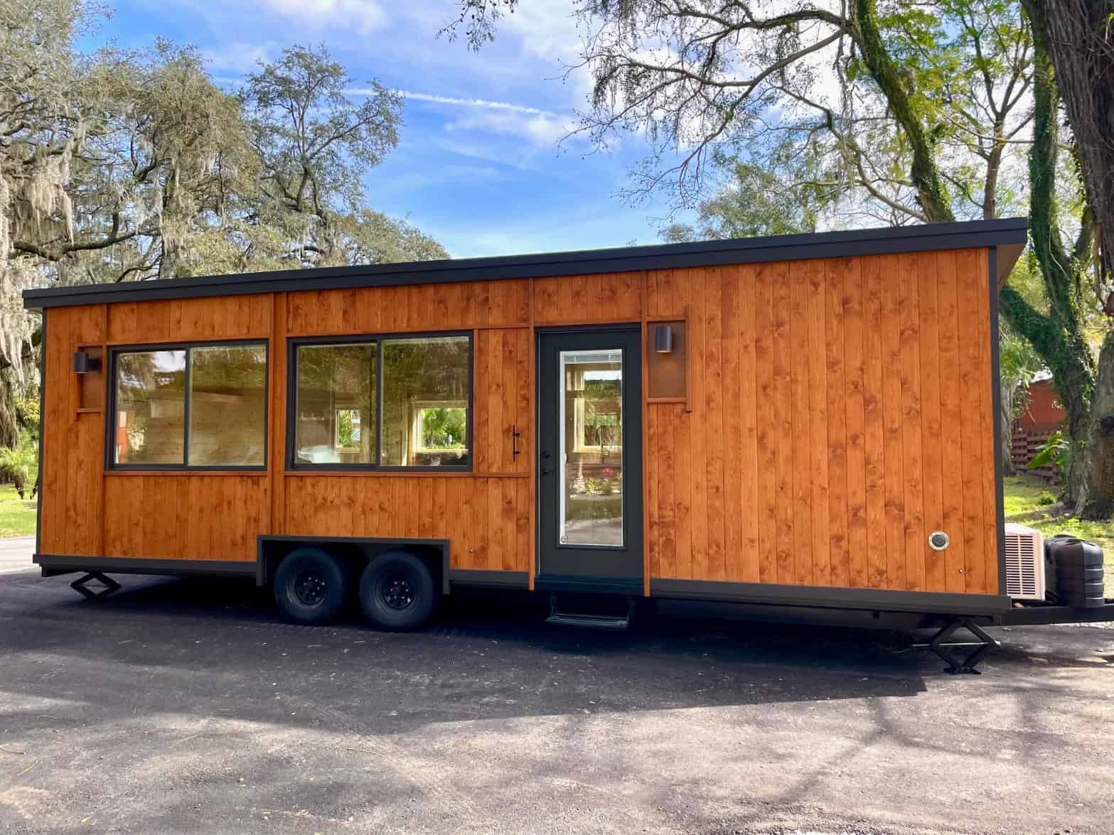 Tiny House with Large Windows and Wooden Exterior