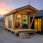 Tiny House with modern design and large windows, showcasing small space living.