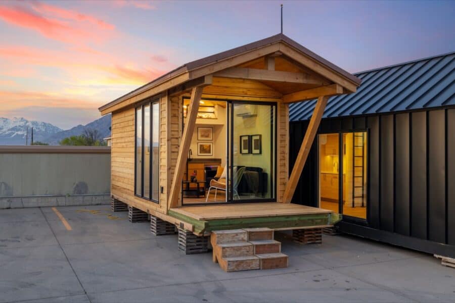 Tiny House with modern design and large windows, showcasing small space living.