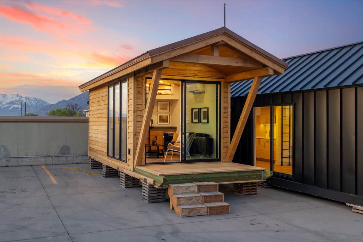 Tiny House with modern design and large windows, showcasing small space living.