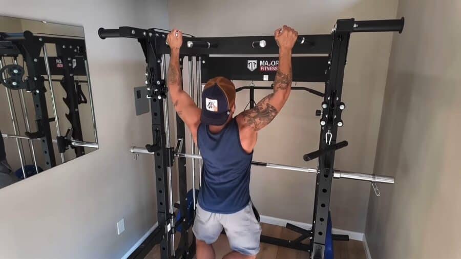 Small backyard gym setup inside a tiny house with workout equipment.