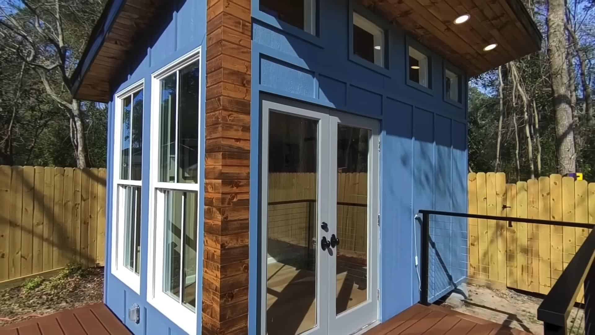 Tiny House with Blue Exterior and Large Windows