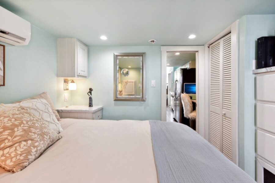 Bright tiny house bedroom with cozy bed and modern decor near Austin.