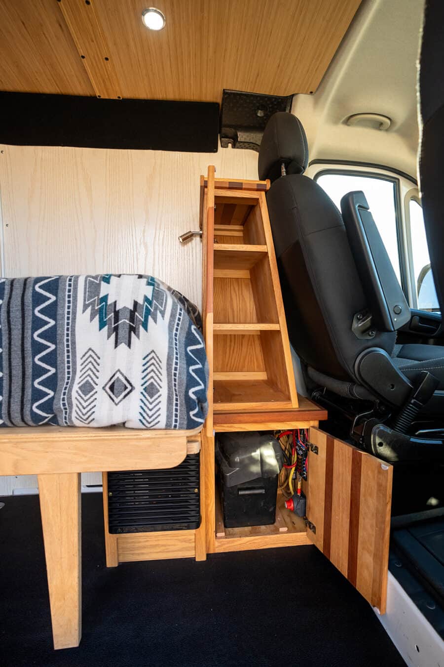 Efficient storage solutions in a 2018 Ram Promaster camper van for small space living.