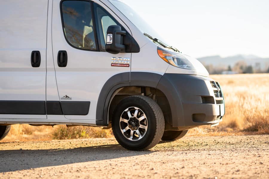 2018 Ram Promaster 118" camper van parked outdoors in a rural setting.