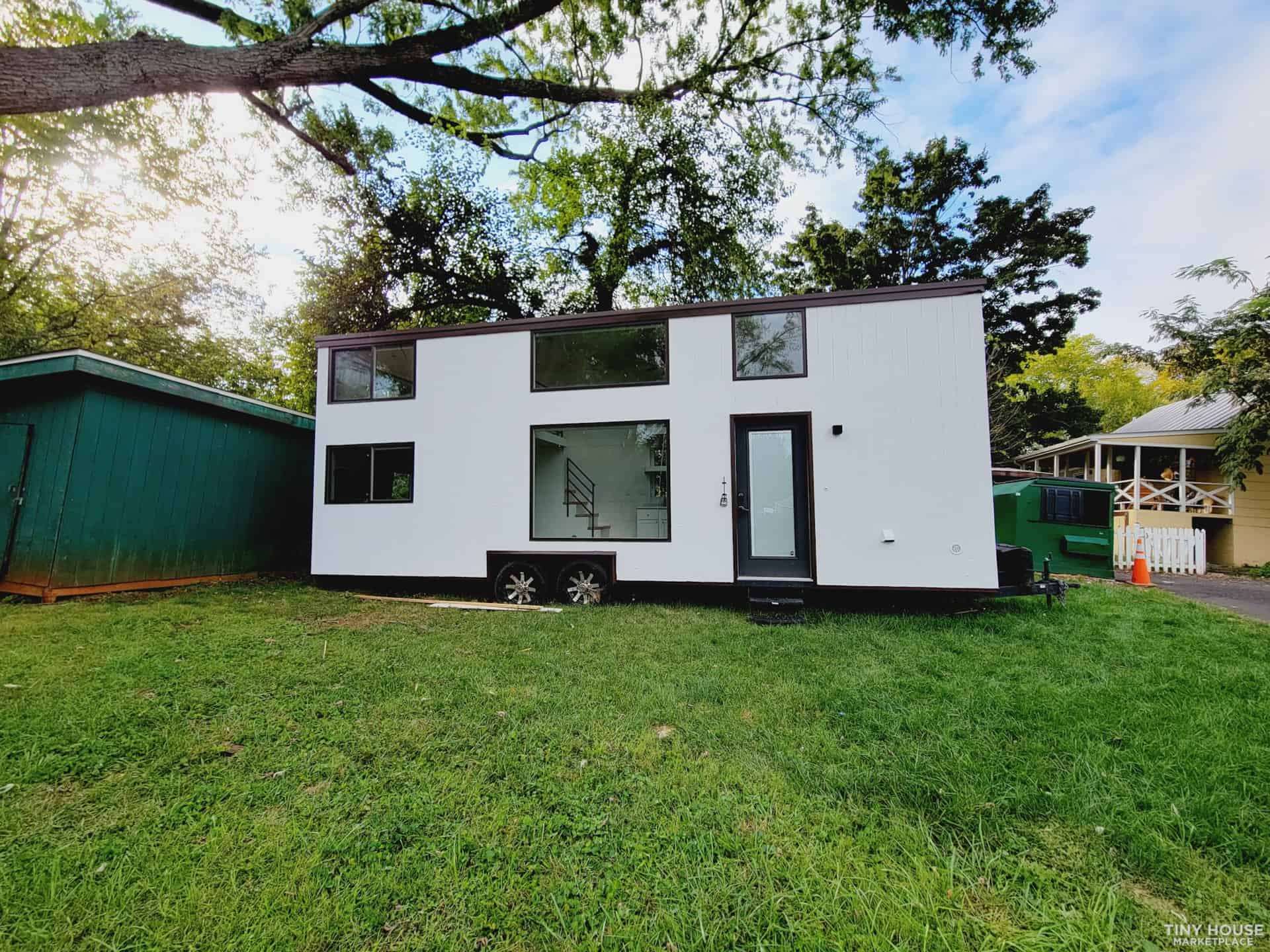 Tiny House with Modern Design and Large Windows