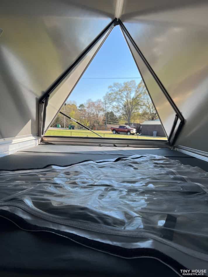 Antishanty pop-up camper set up showing over 9 feet of headroom