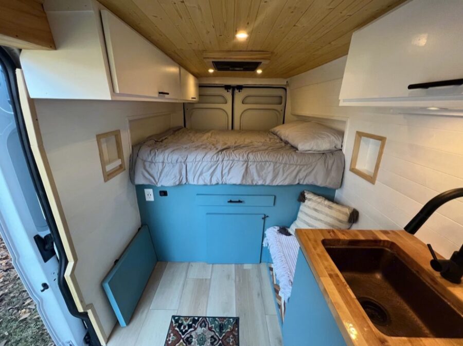 Comfortable queen-sized bed in the van