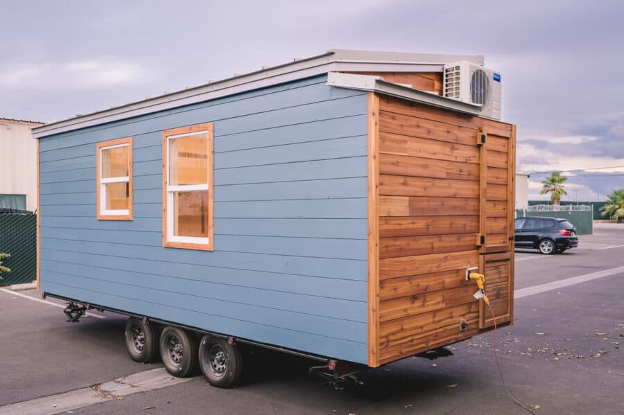 Compact 8x20 tiny house with modern design and efficient space utilization.