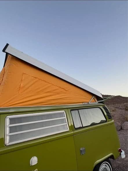Pop-top canvas with window openings, seen from outside