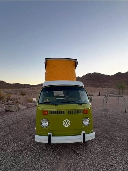 The Westfalia with its orange pop-top raised, seen from the front