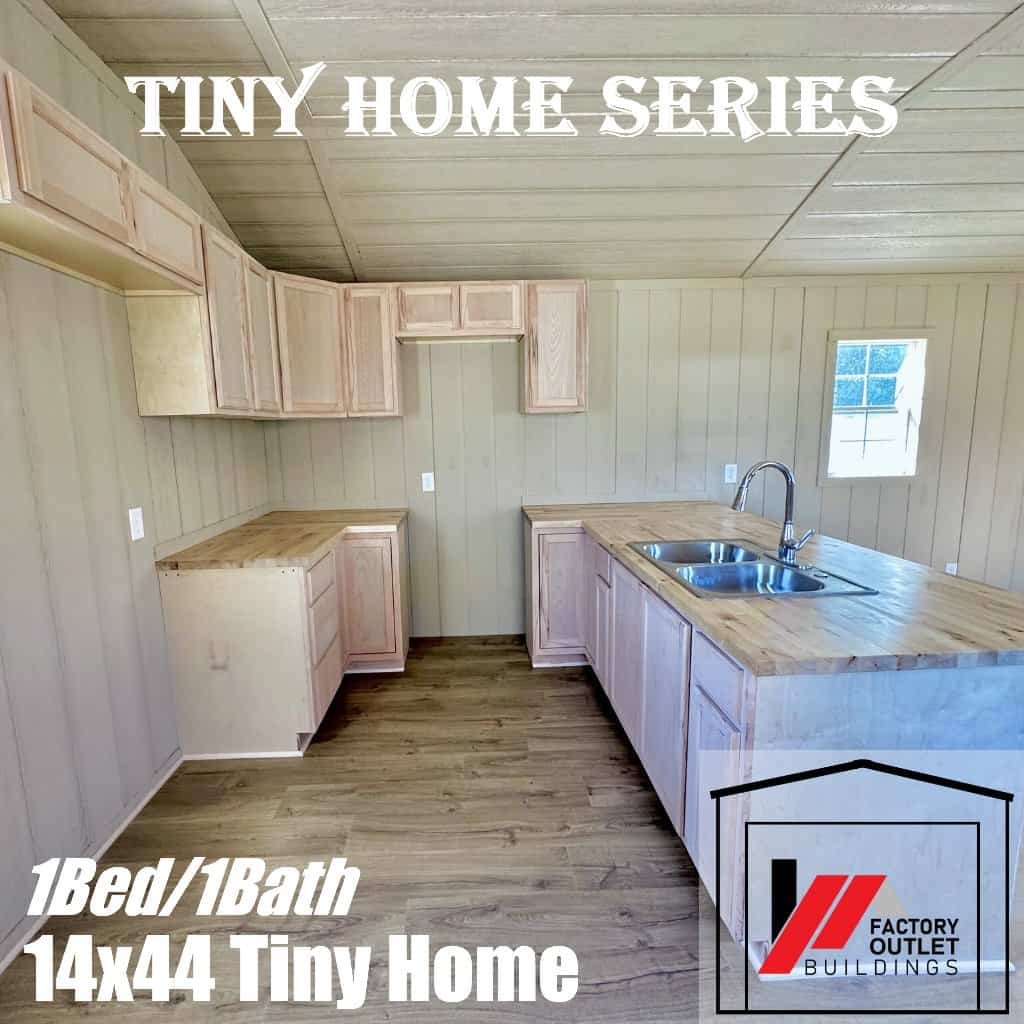 L-shaped corner kitchen with unfinished wood cabinets, butcher-block counters, and a double stainless sink