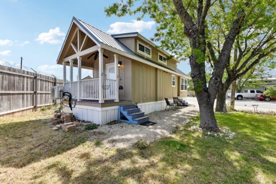 Tiny house with porch near Austin, Texas, showcasing small space living.