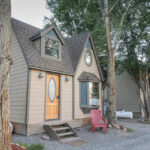 Charming tiny house in Colorado featuring 250 sq. ft., stylish exterior, and small space living comf.