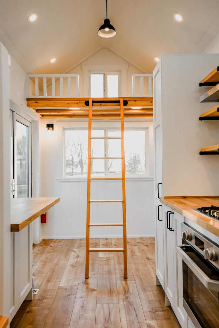 Tiny House Interior with Loft and Wooden Ladder.