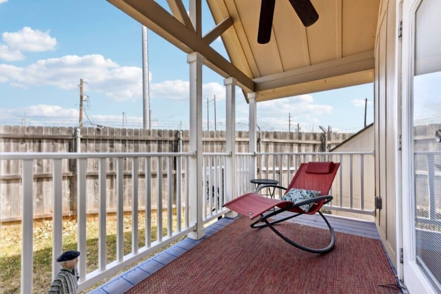 Charming tiny house porch with rocking chair and outdoor space near Austin, perfect for small space.