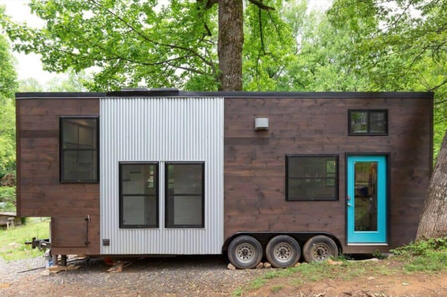 28-foot tiny house on wheels by Tiny House Basics with modern dual loft design