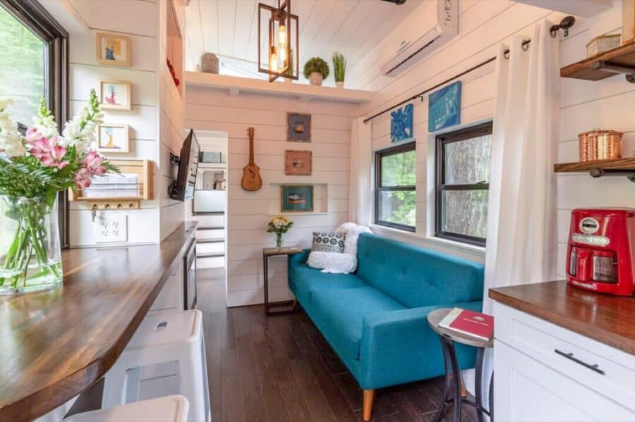 Living area with blue sofa and natural light