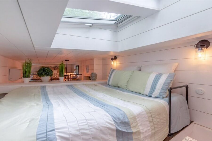 Loft bedroom with skylight for stargazing in the 28-foot THOW