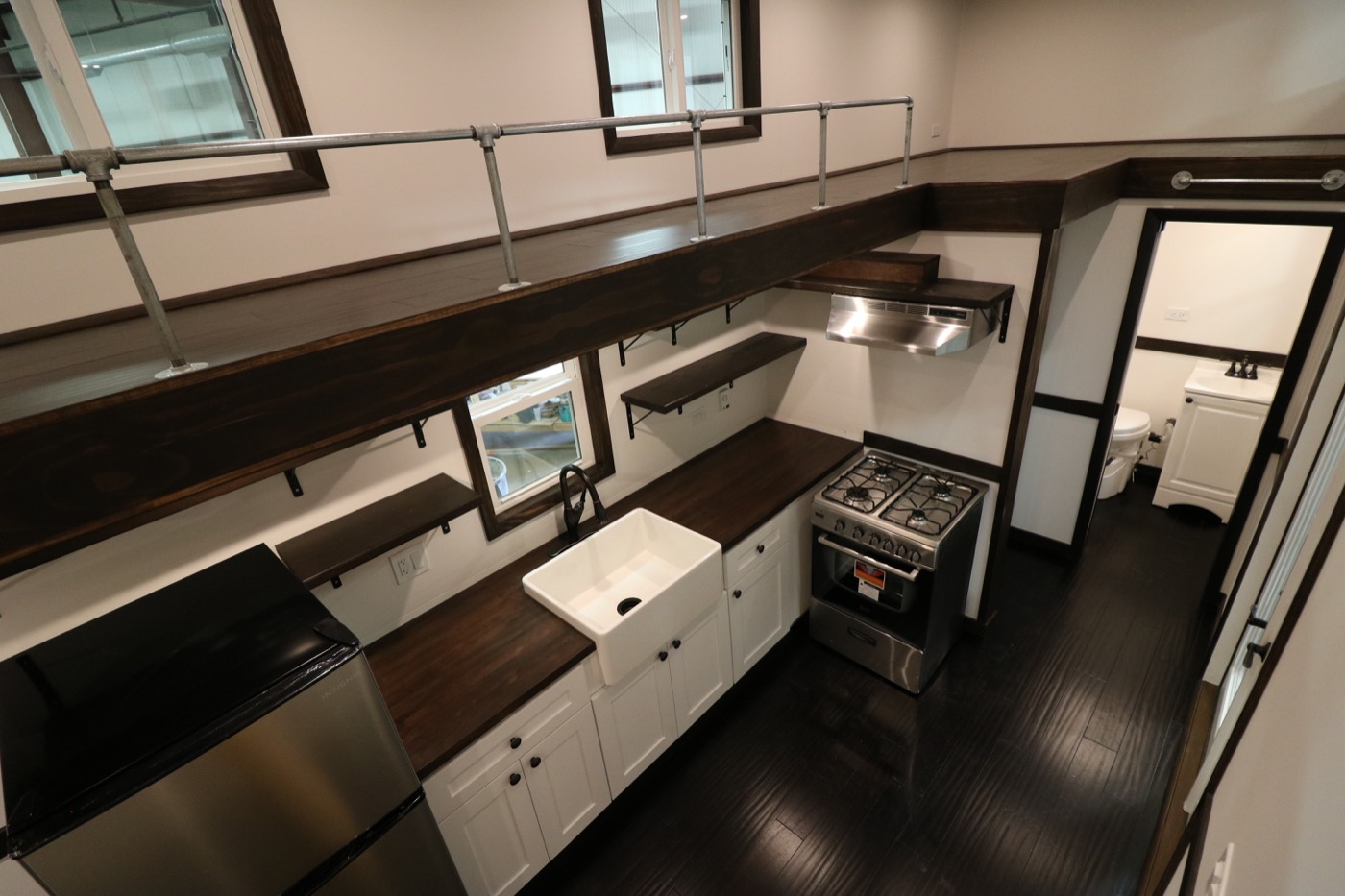 Family of Three’s Off-Grid Tiny House with 12ft Loft-to-Loft Catwalk