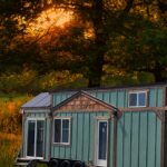 Tiny House with First Floor Bedroom and Two Lofts for Small Space Living.