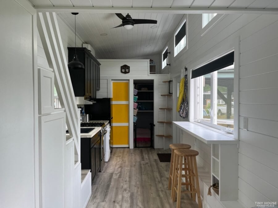 Tiny house interior with screened porch in Asheville community.