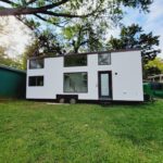 Modern tiny house with double loft in Charlottesville, VA for small space living.