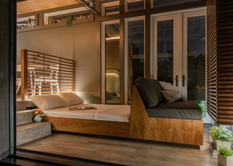 New Frontier Design Orchid tiny house lit up at night