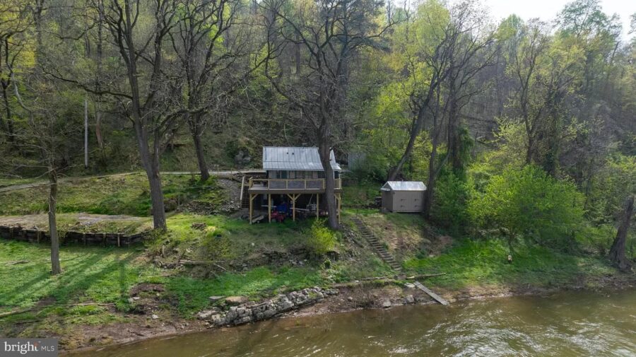 Small cottage on a wooded riverside property in Pennsylvania.