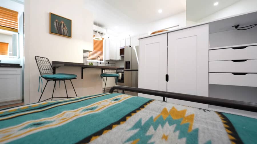 Modern tiny house interior with compact kitchen and cozy living space.