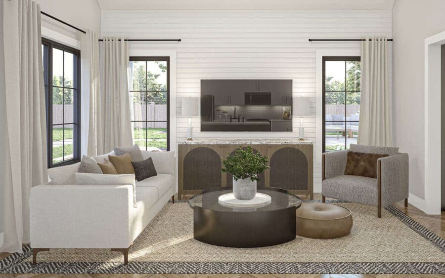 Bright living room with modern furniture and large windows in a tiny house.