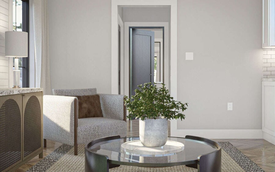 Bright and airy small living space with minimalist furniture and natural light.