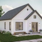 Bright and modern tiny house with white exterior and large windows.