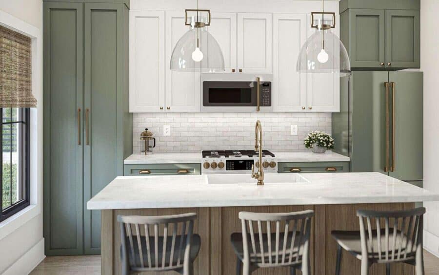 Modern tiny house kitchen with green cabinets and white countertops.