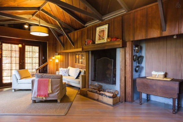 living area with exposed beams in ceiling