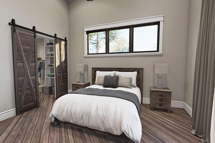 Cozy bedroom in a small house with large window and modern decor.