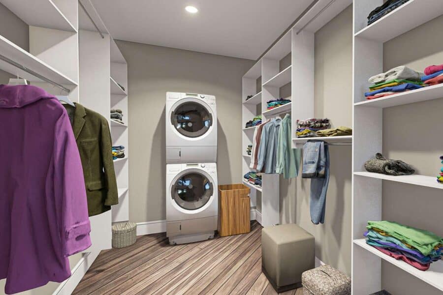 Small laundry room in a tiny house with shelves and hanging space for clothes.