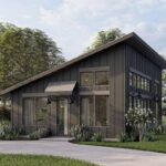 Modern small house with dramatic roof design and sleek black exterior. Perfect for tiny house enthus.