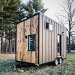 Modern 8x16 tiny house on wheels featuring Western cedar siding and sleek design.