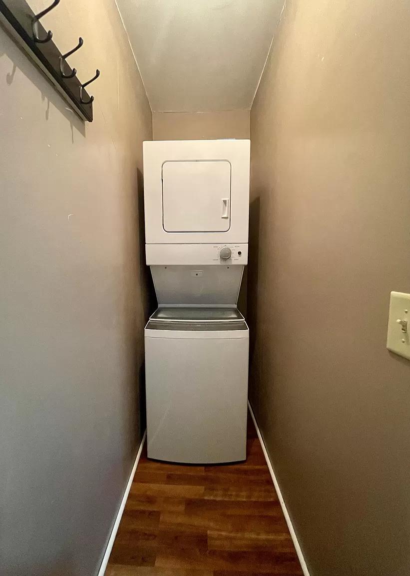 Laundry closet in a small home with stacked washer and dryer.