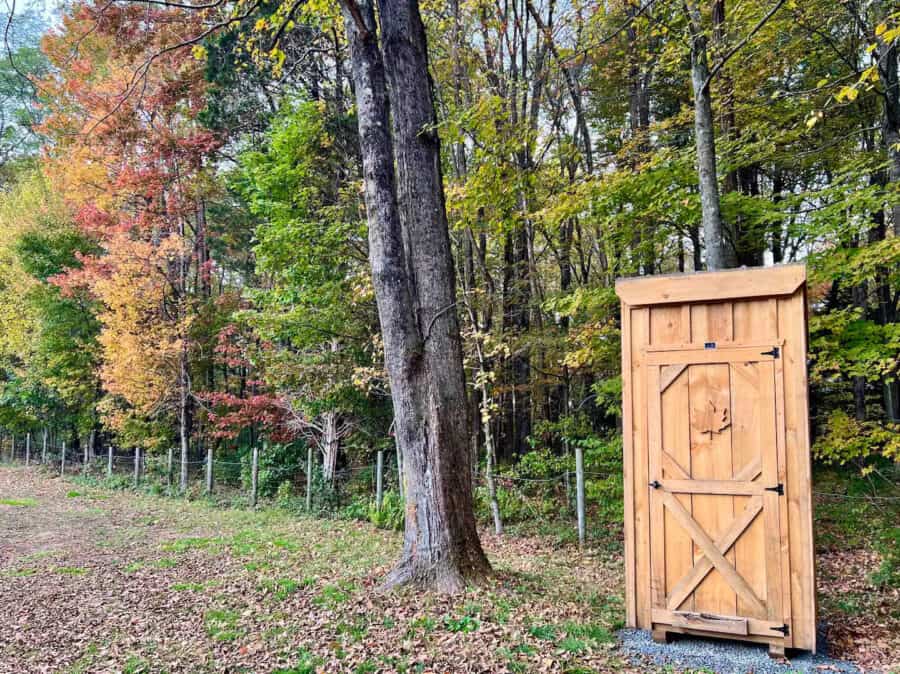 A-frame Fox Earth Cabin on Massachusetts farm with wooden outdoor toilet.