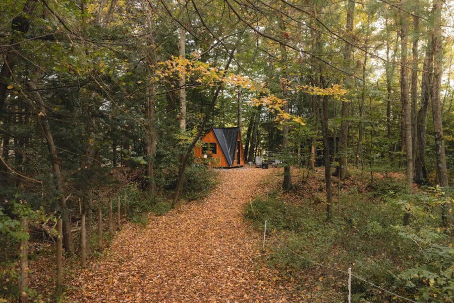 A-frame Fox Earth Cabin in a forest setting on a Massachusetts farm.