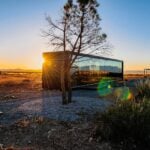 Self-Sustaining PodTel Tiny House in Spain at sunset.