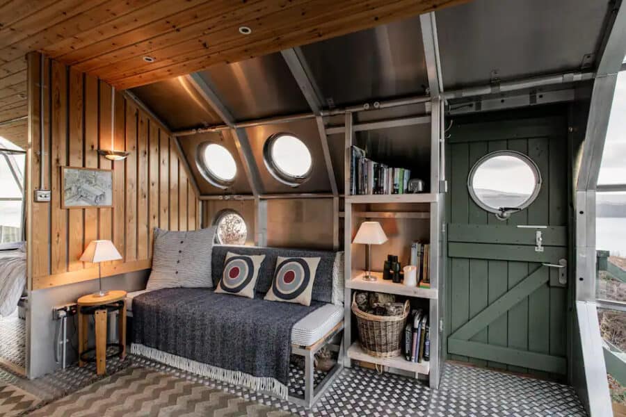 Interior of the AirShip 2 tiny house featuring unique dragonfly eye windows in Scotland.