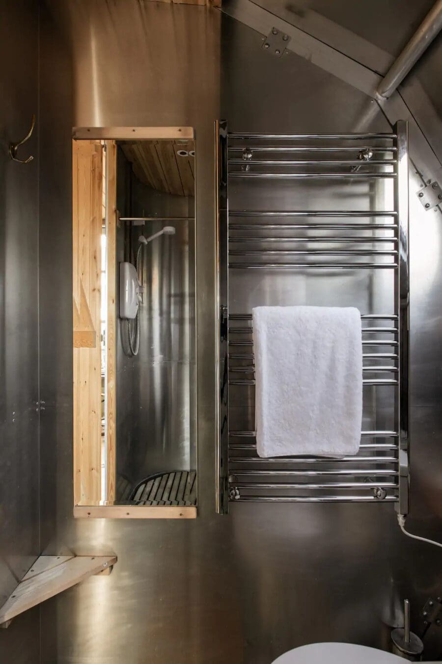 Interior view of AirShip 2 tiny house featuring dragonfly eye windows in Scotland.