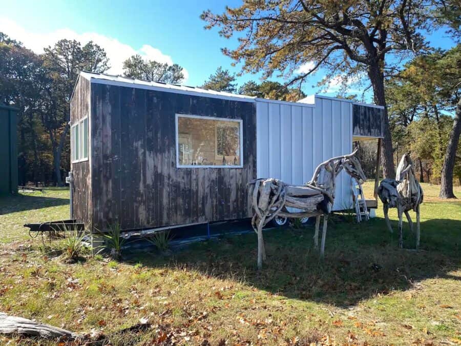 Tiny house on a 40-acre preserve in Upstate New York, surrounded by nature and tall trees.