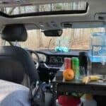 Interior view of Blake's Kia Niro EV stealth camper with small living and cooking space.