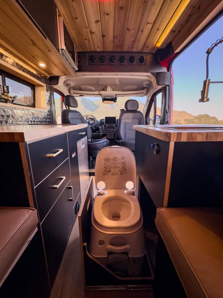 Efficient tiny house on wheels with cozy boho decor and smart storage solutions.